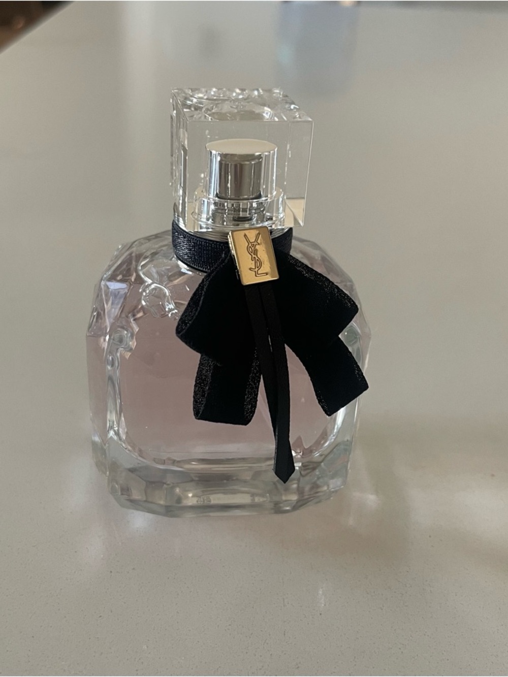 Yves Saint Laurent Pink Fragrance Bottle with Black Bow and Gold Charm. 1.6oz
